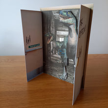 Load image into Gallery viewer, Raptor dinosaurs coming thorugh open door card