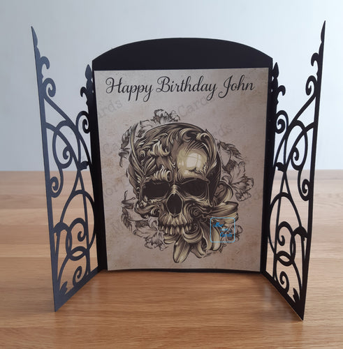 gatefold style card with a skull and lily