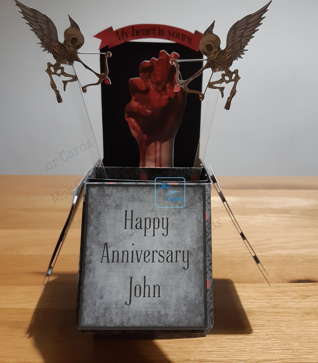 Skeleton cupids with anatomical heart card